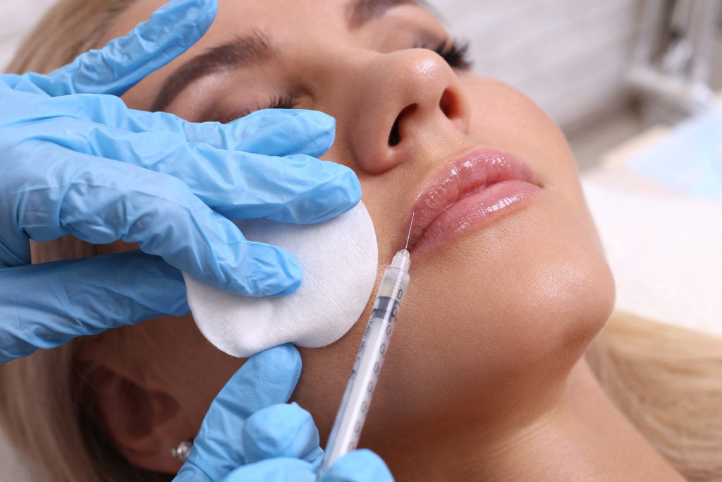 Beautiful girl getting Dermal Filler Injection in her lips | Bradenton Aesthetics in Bradenton, FL